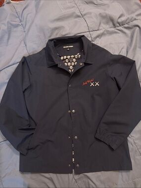 Uniqlo x KAWS Navy Kids Coat with Red Embroidery and White XX